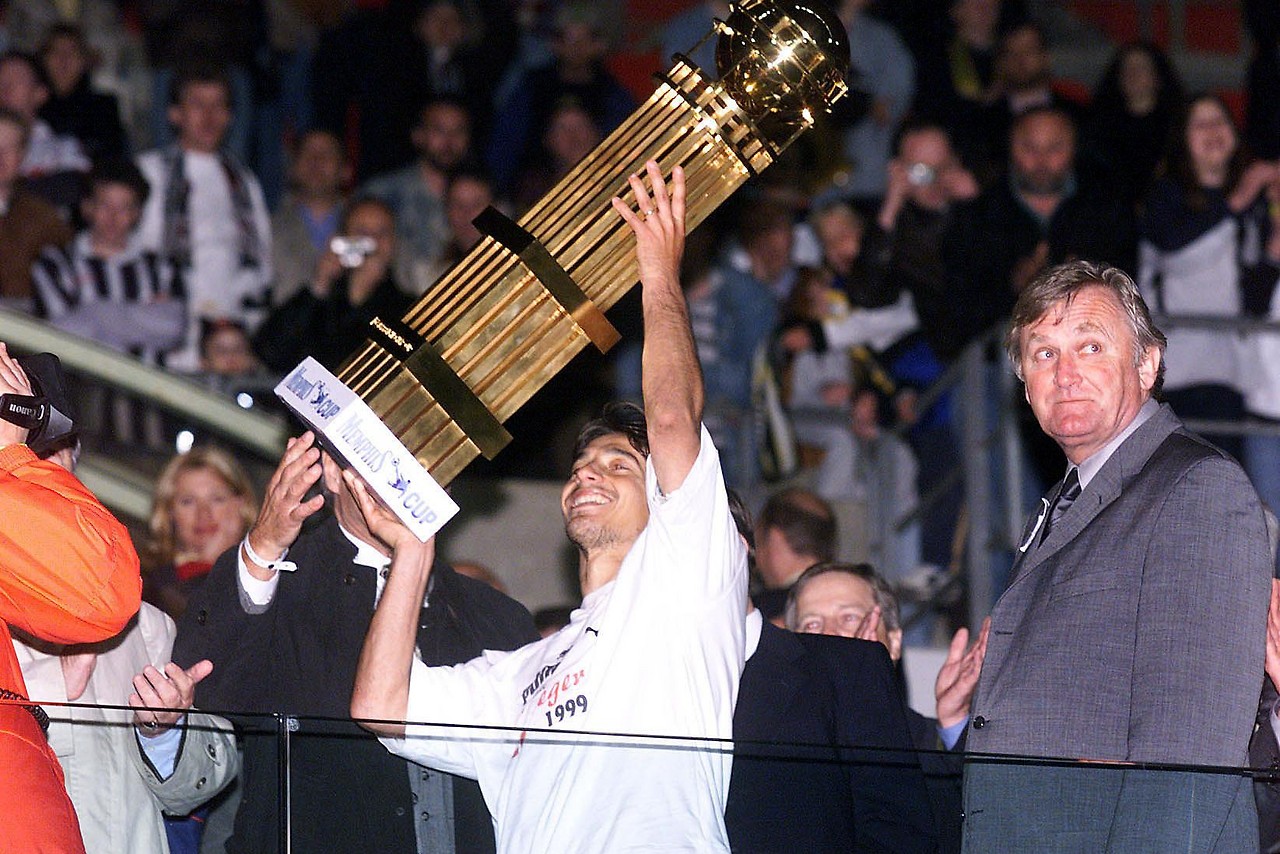 Archive record from 1999 showing Ivica Fastek and coach Ivica Osim with the trophy