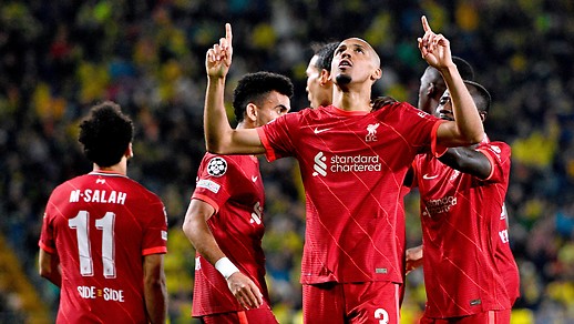 Liverpool's Fabinho cheers with teammates