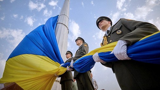 Ukrainian soldiers hold flag